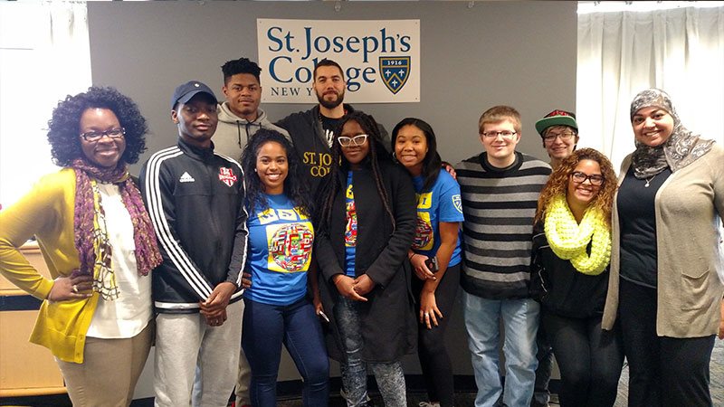 Kane Smego with students and staff