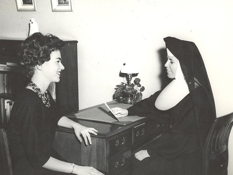 S. John Raymond with student